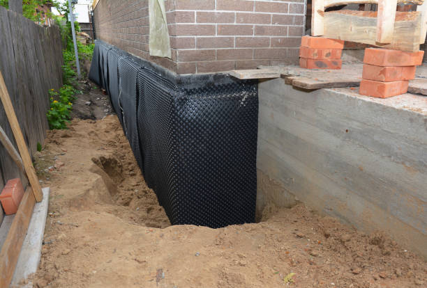 SJ Waterproofing Pros technician performing targeted Basement Waterproofing assessment in Addison, IL